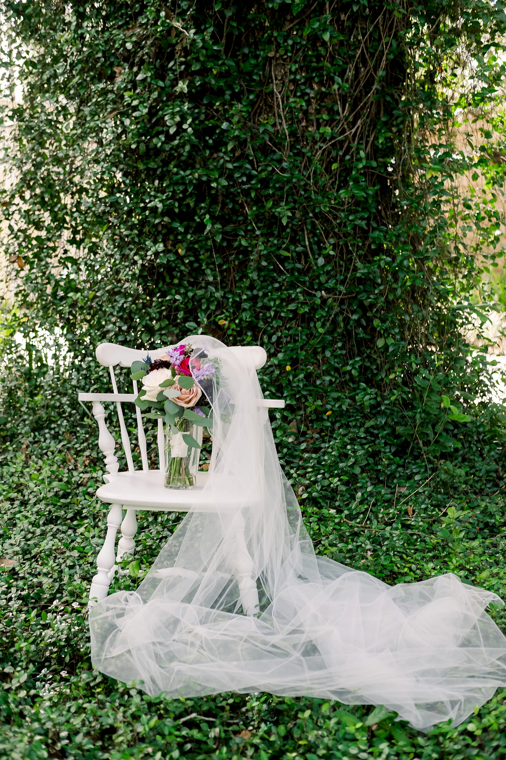 A cross creek wedding day filled with greenery and flowers filled with white tulle