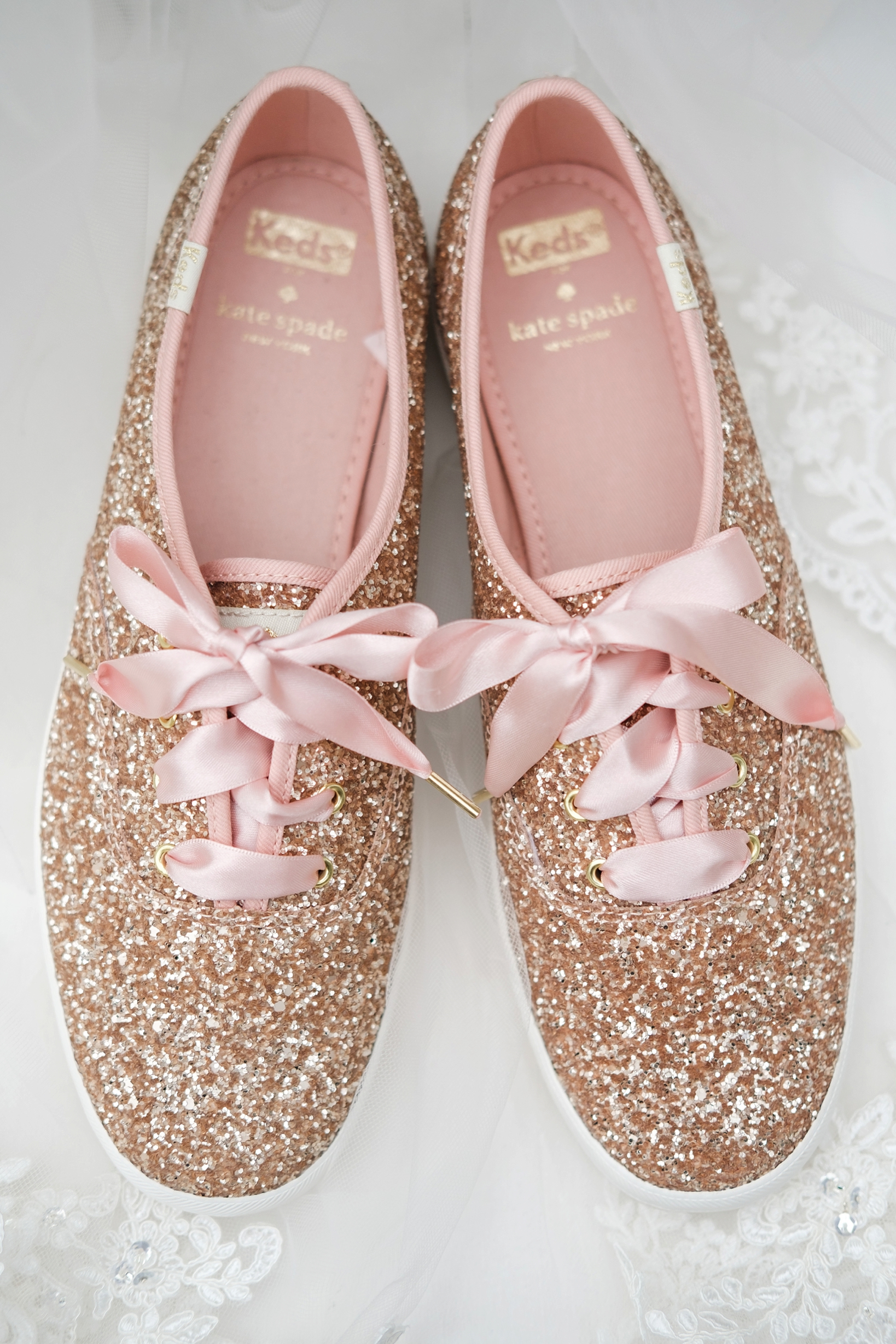 Rose gold Kate Spade sneakers made for dancing during the Bride and Grooms cross creek wedding celebration