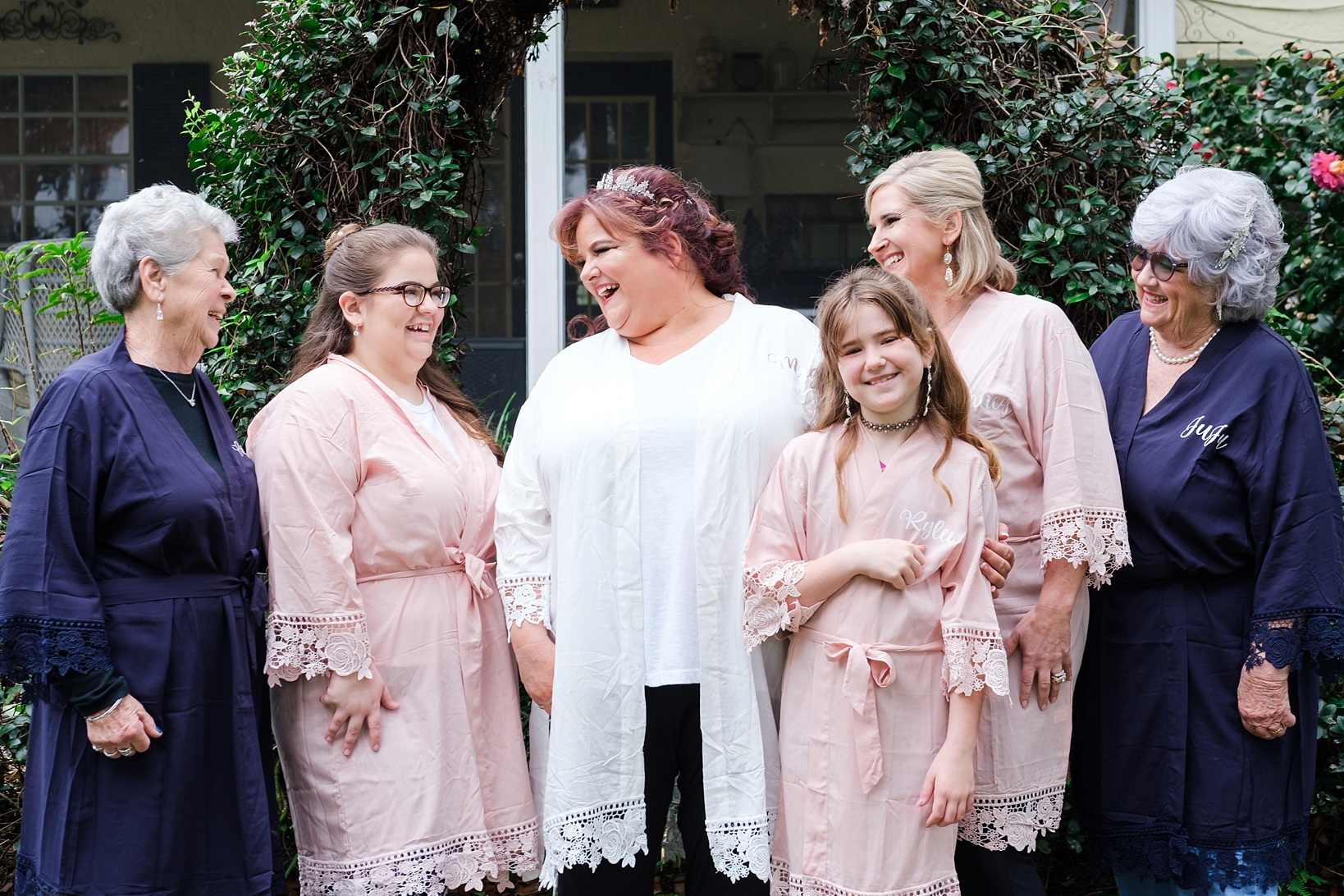 The Bride and her Bridesmaids in robes before the huge cross creek wedding celebration