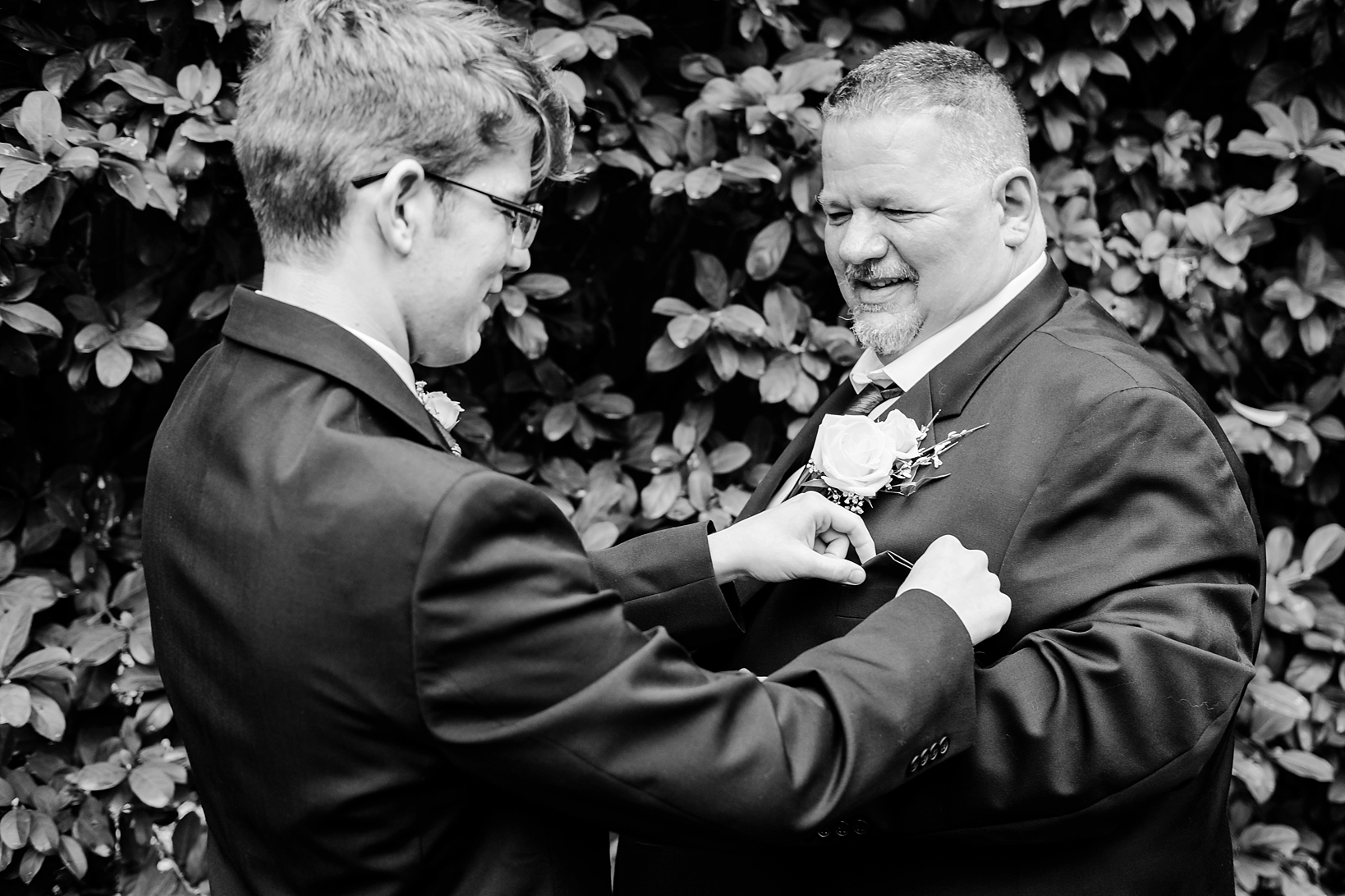 Groom having his pocket square adjusted by his Son before his cross creek wedding celebration
