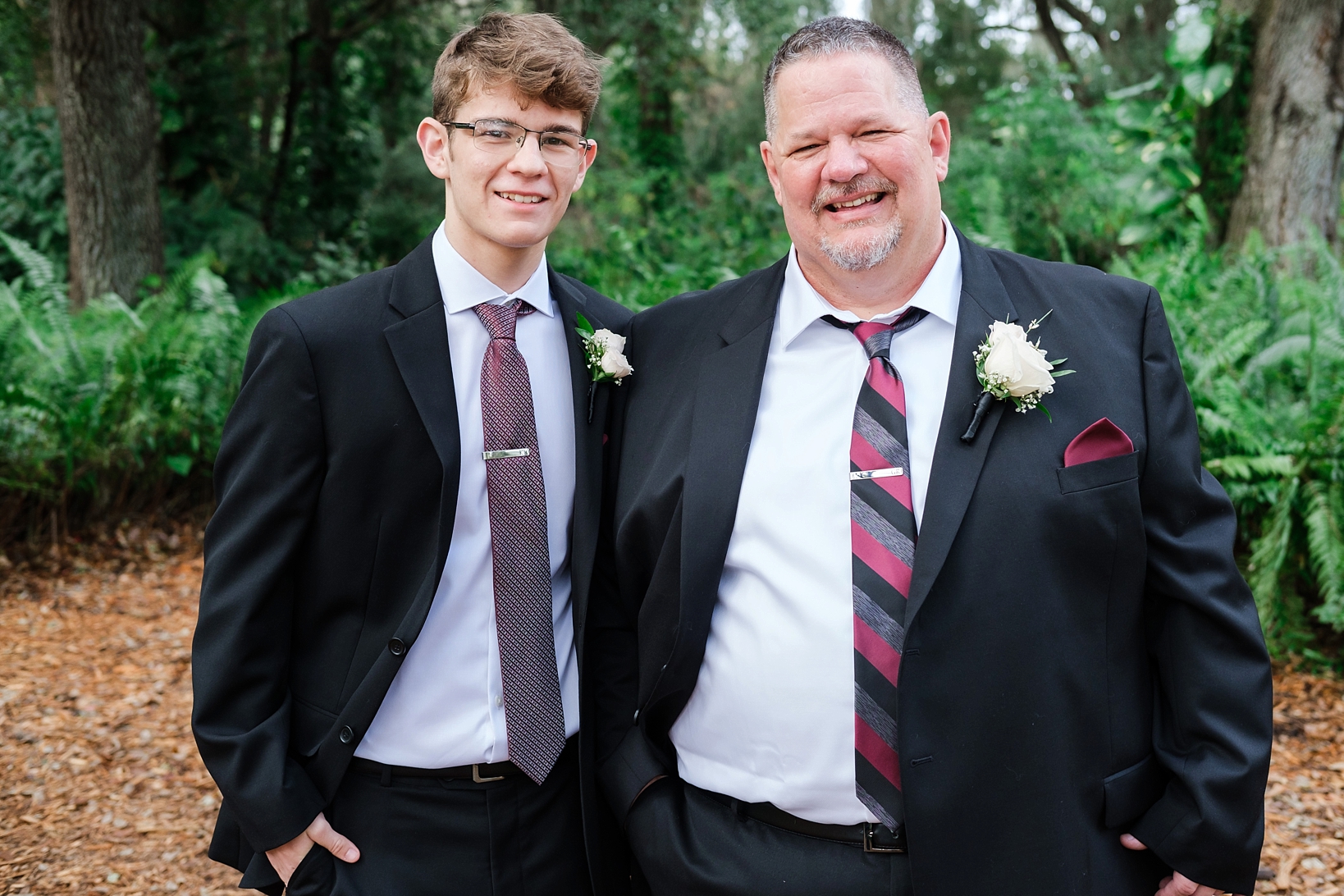 Groom and his Son smile for a formal portrait by Sarah and Ben Photography