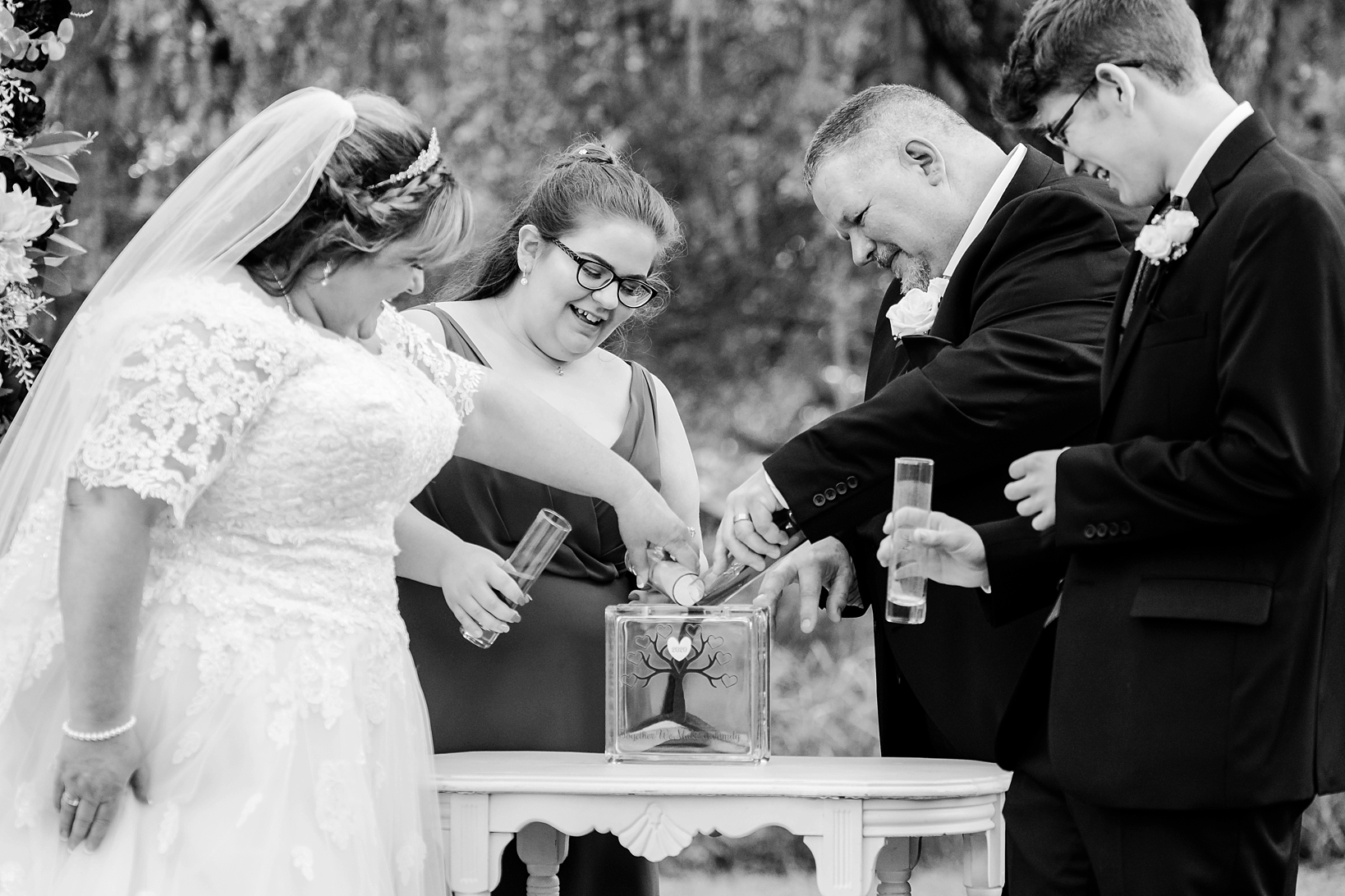 Classic black and white of the wedding celebration with a sand ceremony