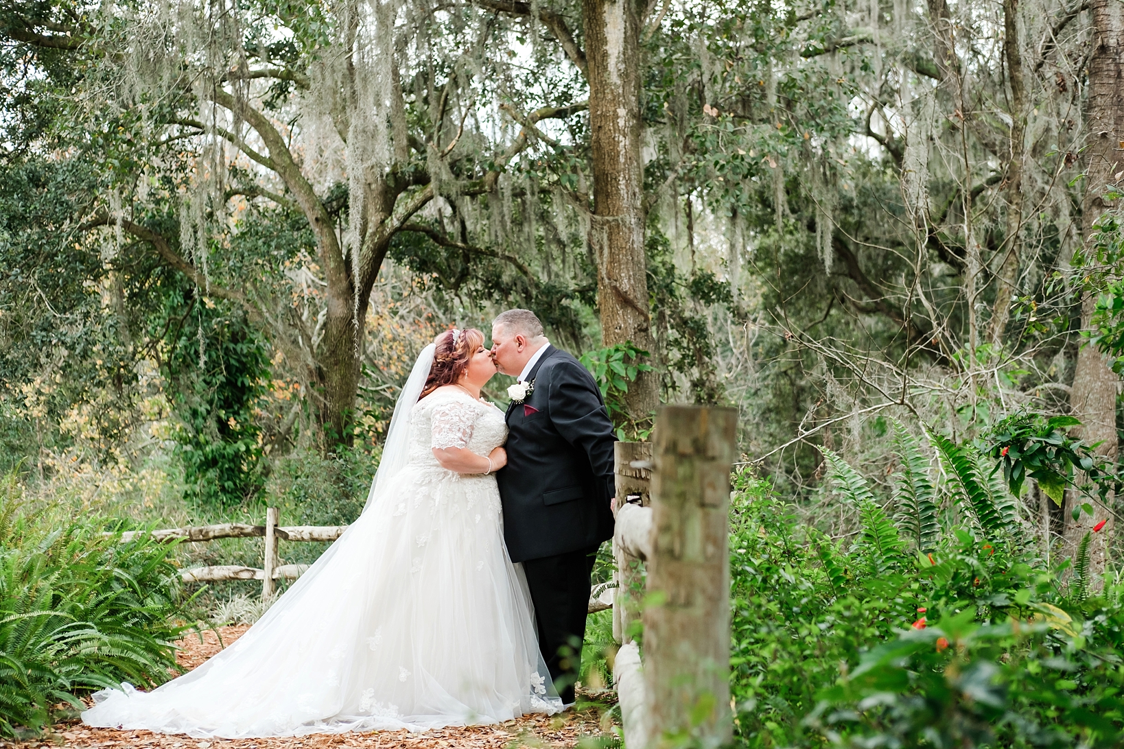 Kissing Newlyweds under the ancient Oaks of Cross Creek Ranch