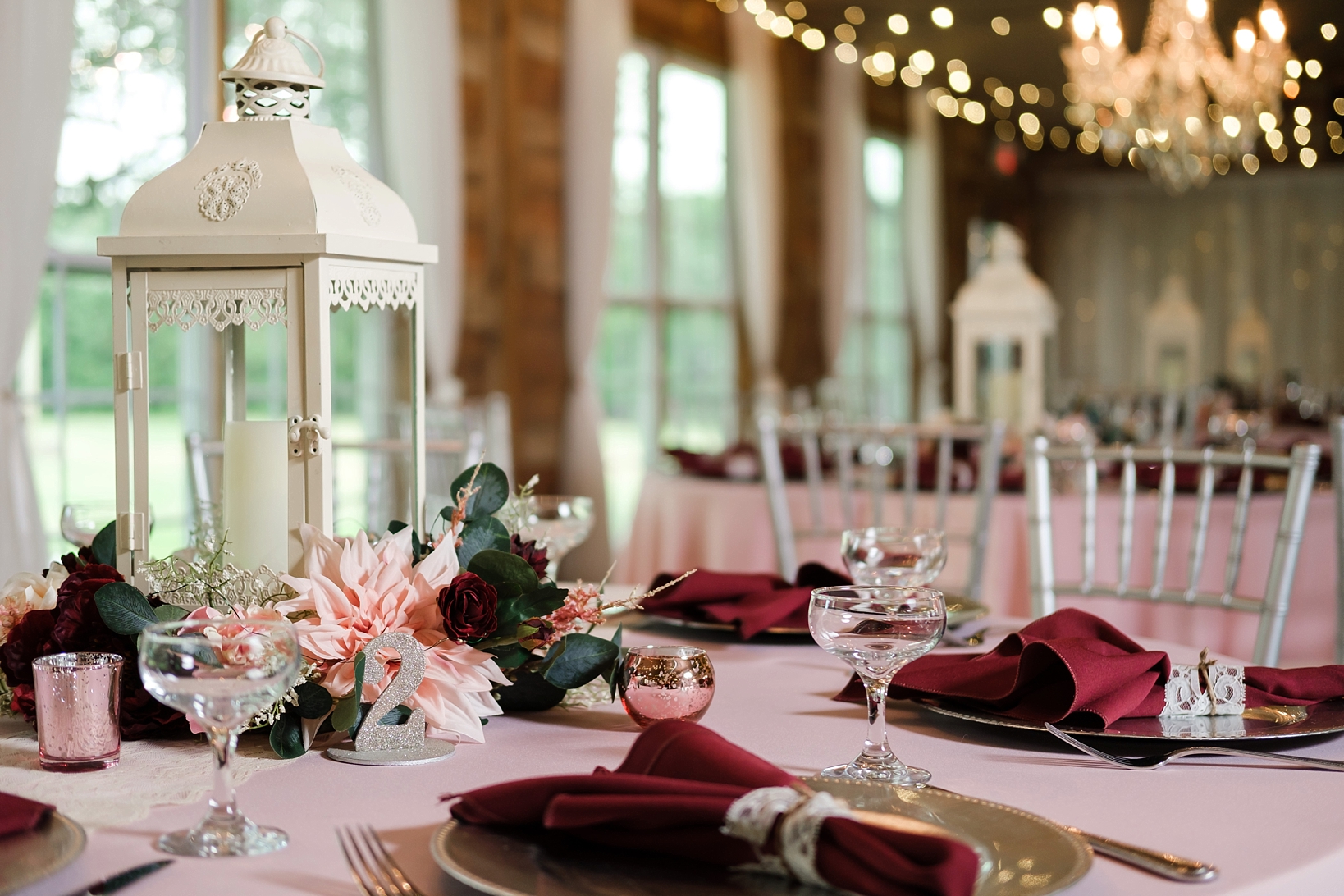 cross creek wedding celebration filled with florals and candle holders and petite champagne glasses