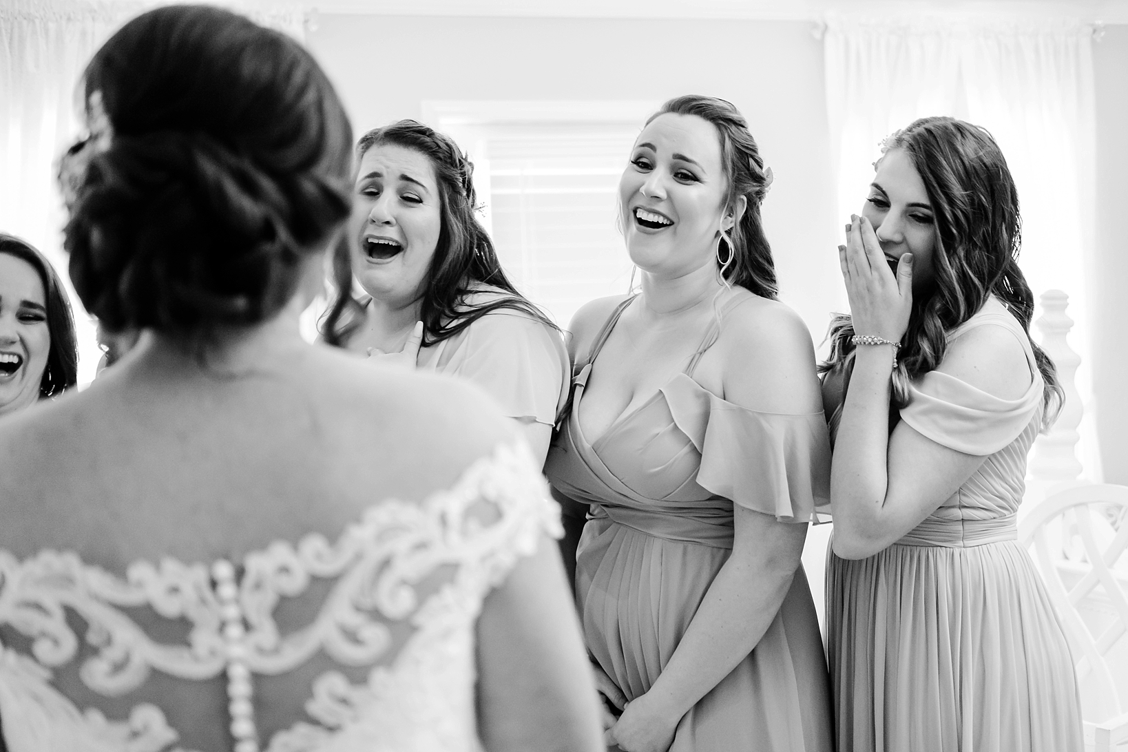 The Bridesmaids react to seeing their friend in her wedding dress for the first time