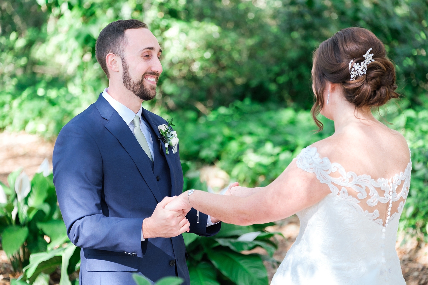 Groom smiles from ear to ear as he sees his Bride for the first time in the forest of Cross Creek Ranch