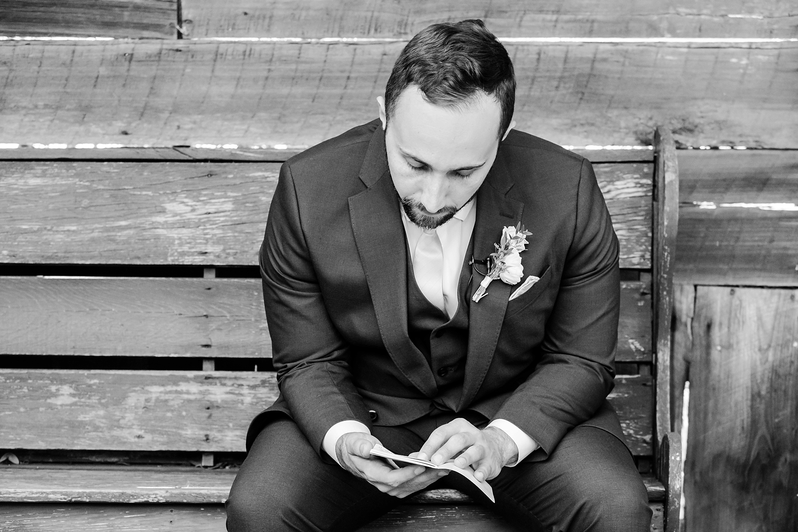 The Groom reads a letter from his Bride before their wedding day