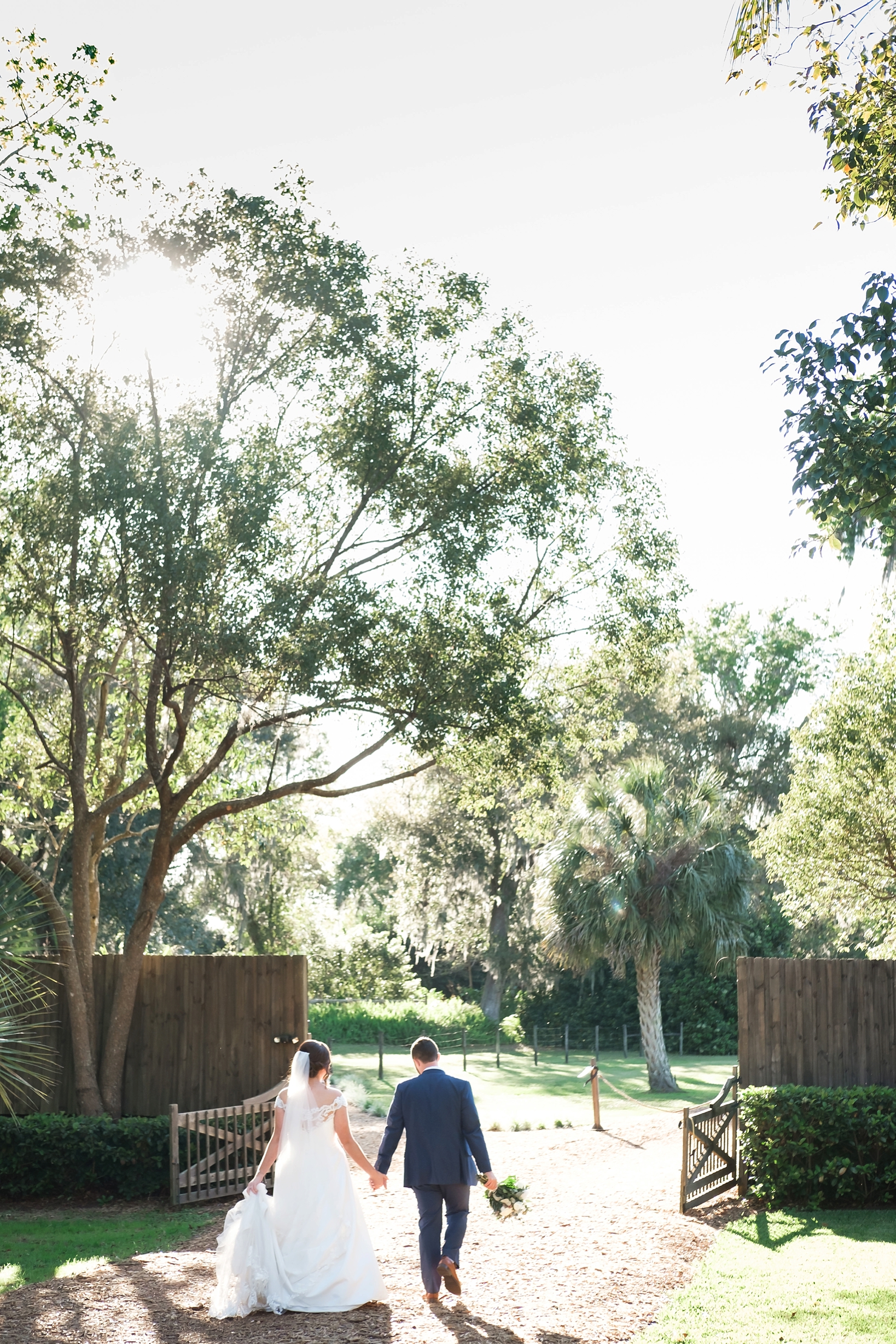 The Bride and Groom walk to their wedding reception under the warm Florida sun
