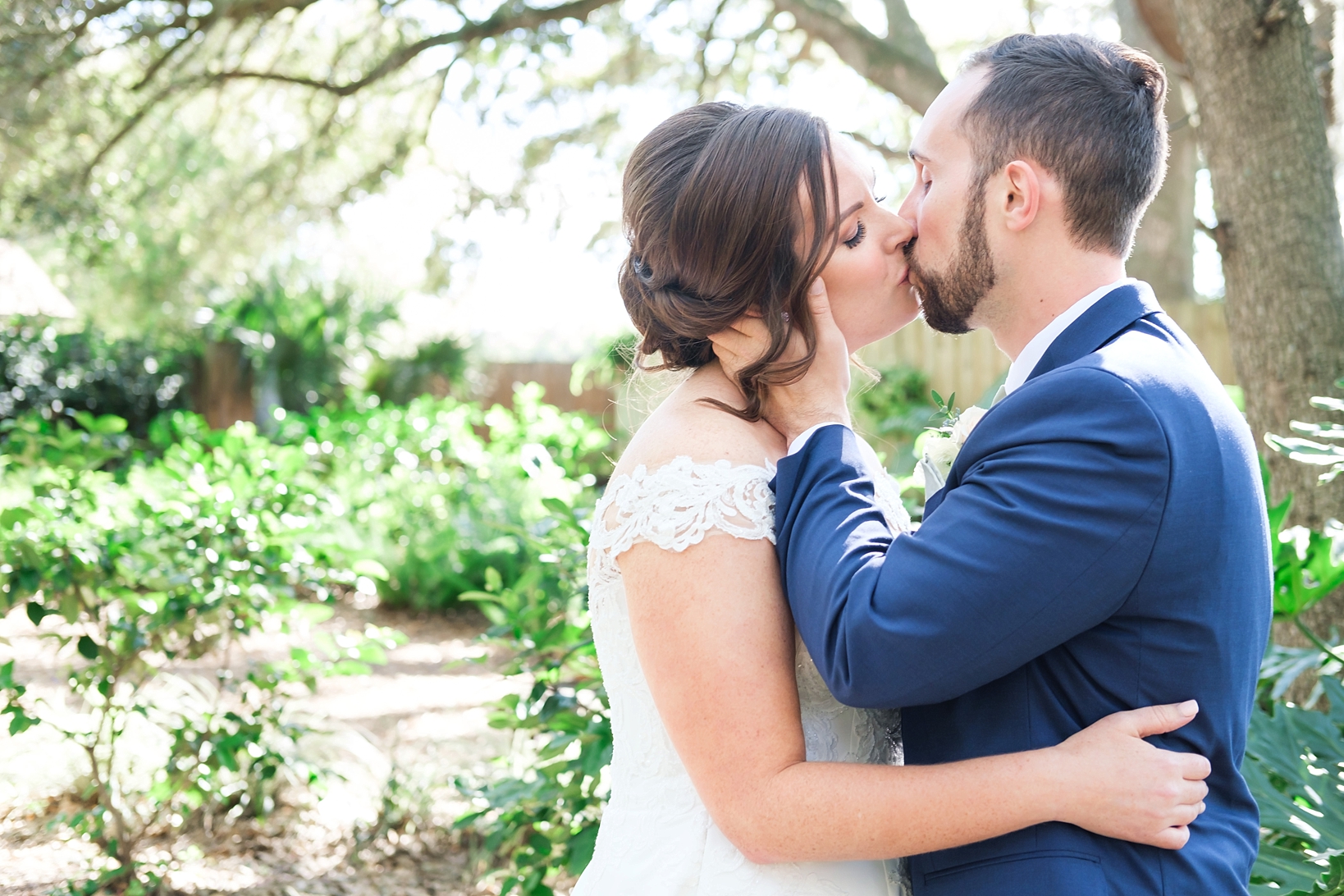 Bride and Groom share a kiss under some oak trees in Seffner, FL