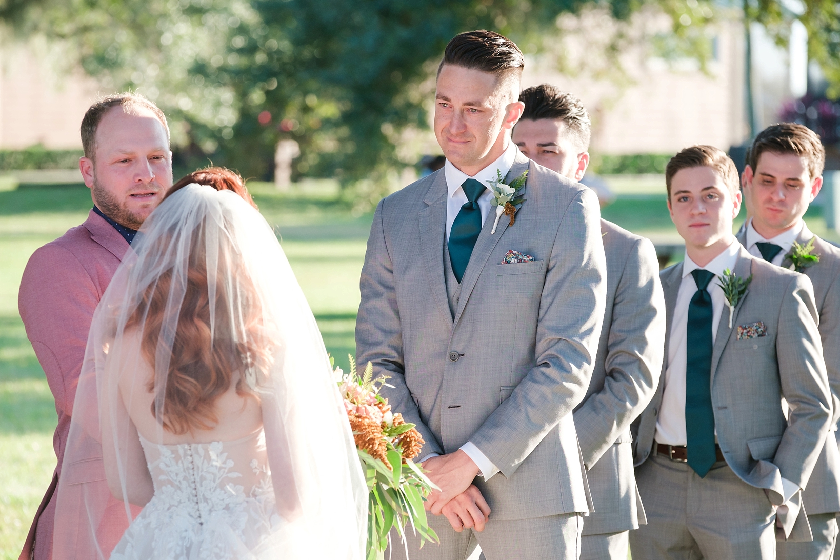 Groom begins to tear up during the vows of his Bride