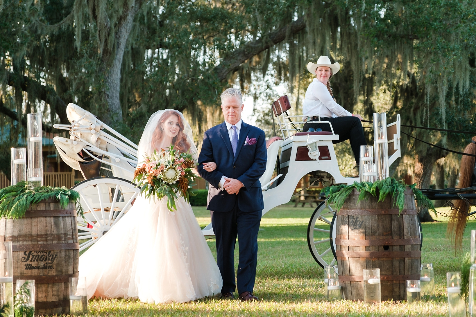 Bride and her Dad arrive to the ceremony in horse drawn carriage