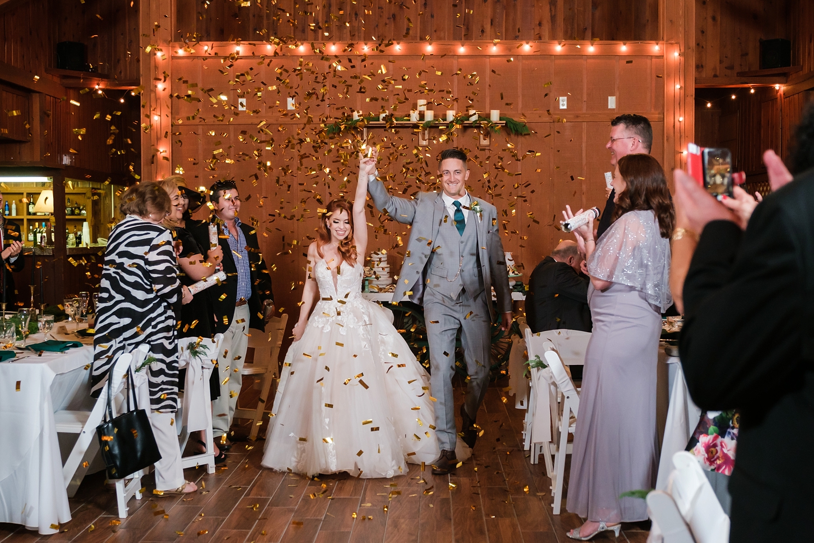 Bride and Groom enter under a canopy of glitter thrown by their guests
