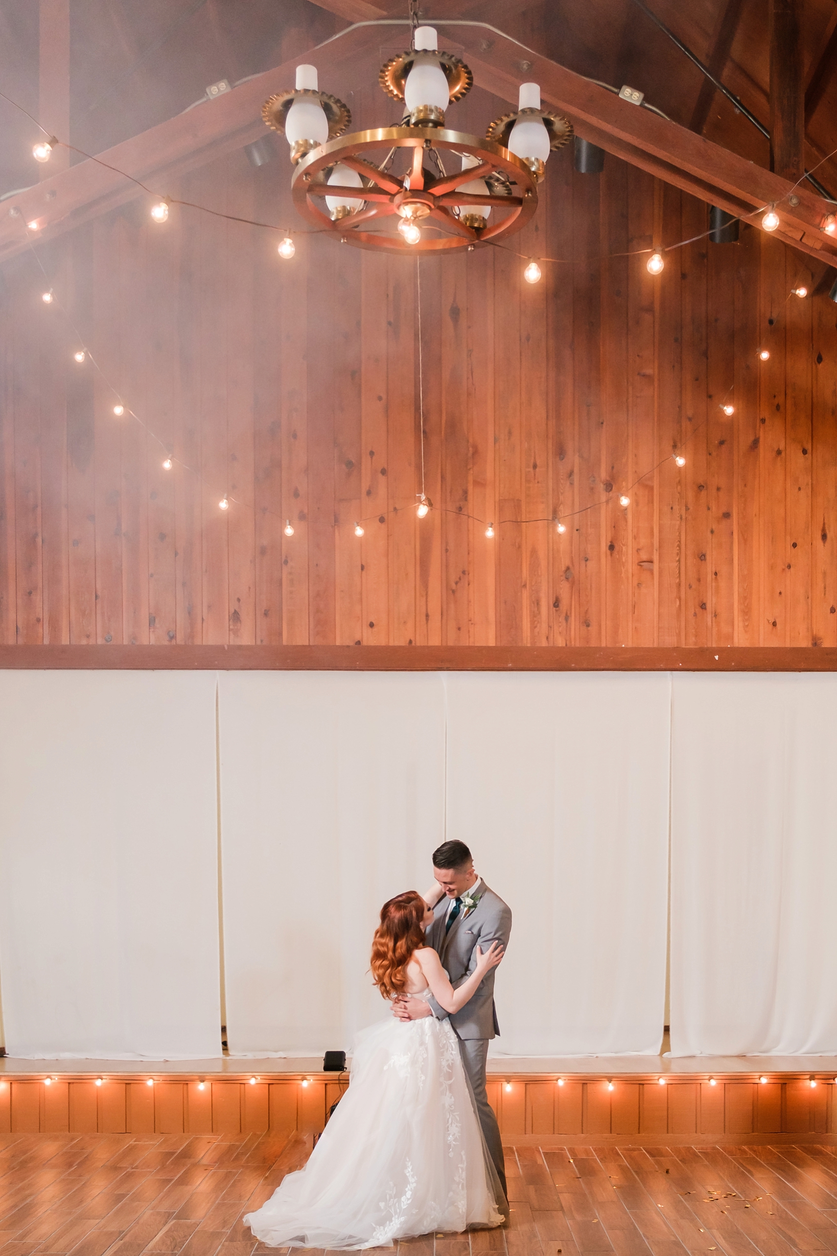 Bride and Groom sharing a first dance under a chandelier at Westgate River Resort