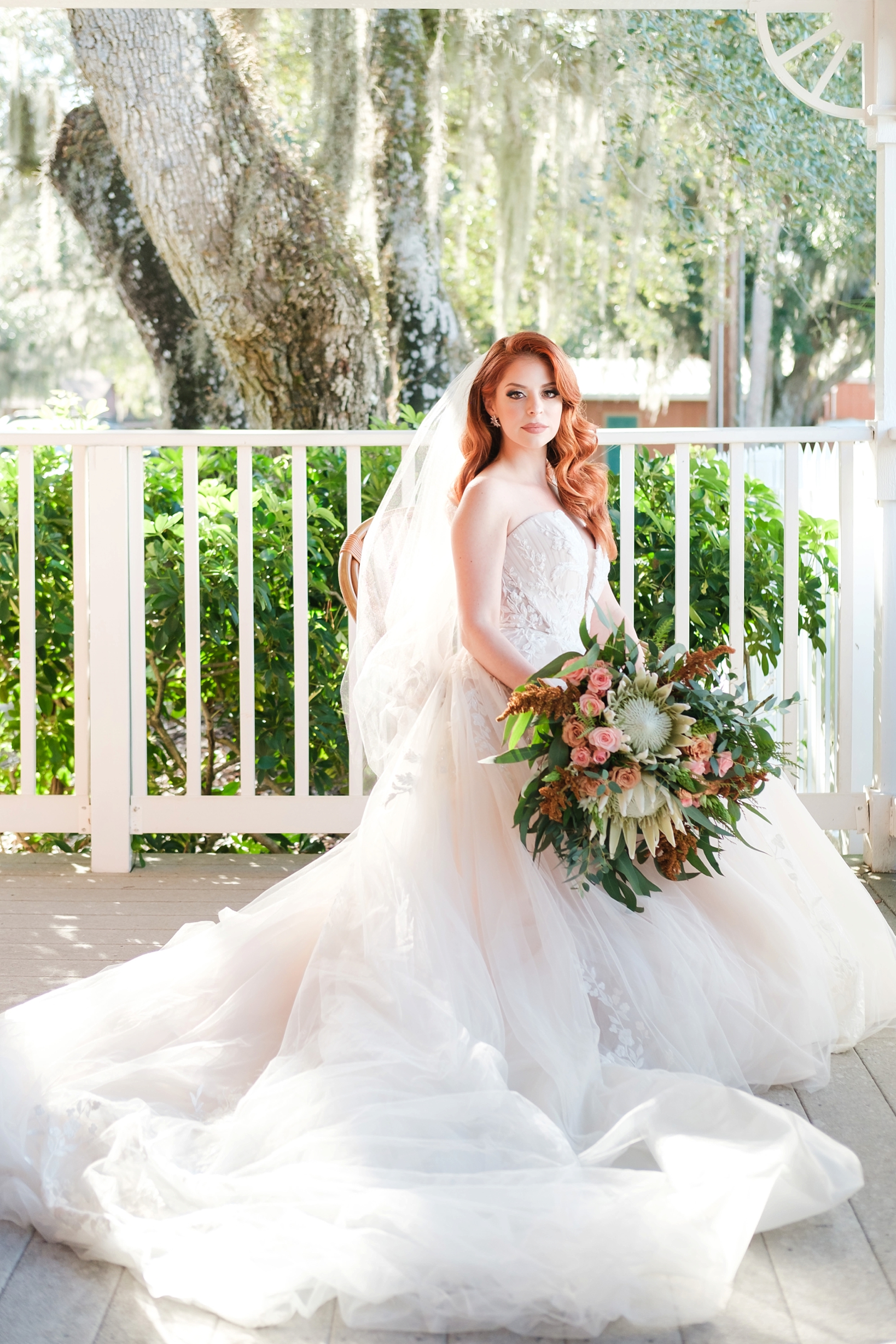 Stunning portrait of the Bride holding her floral boutique