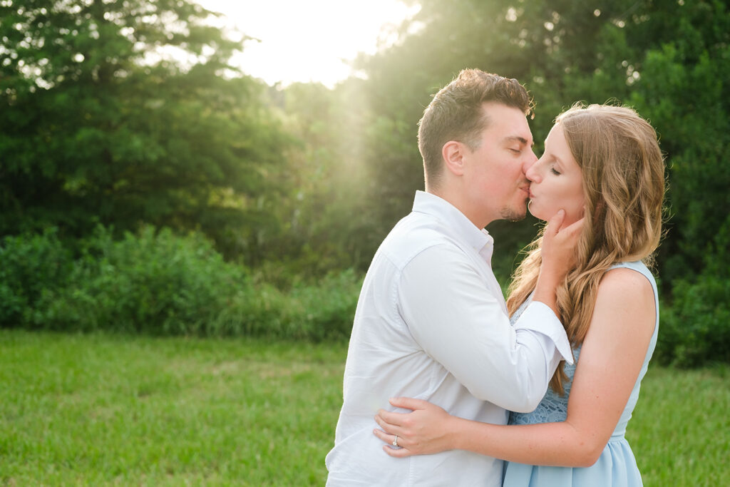A Man and Woman kiss during golden hour in Tampa, FL