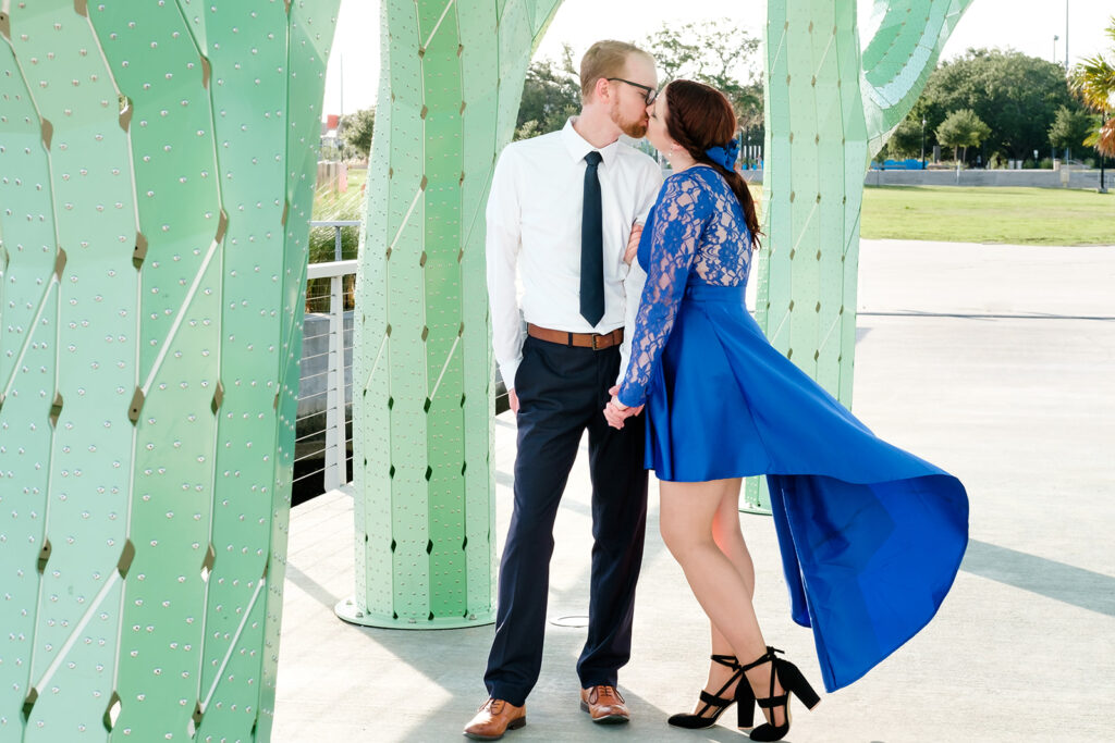 Couple poses on the Tampa Riverfront for Engagement Pictures by Sarah & Ben
